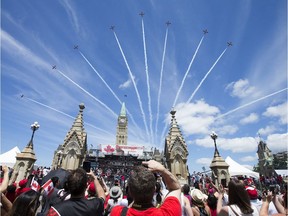 The Snowbirds fly over Parliament Hill as Canada Day activities are in full swing through out the downtown core. Photo by Wayne Cuddington/ Postmedia