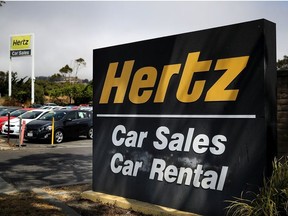 A sign is posted in front of a Hertz car sales and rental car office on August 8, 2017 in South San Francisco, California.