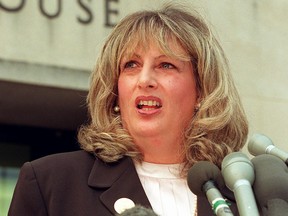 In this file photo taken on July 29, 1998 Linda Tripp talks to reporters outside of the Federal Courthouse in Washington, D.C., following her eighth day of testimony before the grand jury investigating the Monica Lewinsky affair. (WILLIAM PHILPOTT/AFP via Getty Images)
