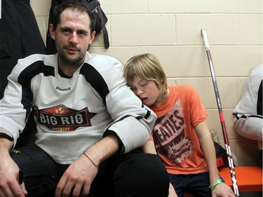 NOVEMBER 21,  2012 --- Chris Phillips's young son, Ben, 9, was showing signs of wear and tear at the end of the tour, taking his dad's shoulder between periods.  The Northern Lights Dream Tour wound up Wednesday with a final game in Whitehorse, Yukon, followed by long flights home on Thursday for the players - many with three connections and 15 to 20 hours in the air.