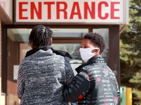 Twelve-year-old Cruz Fede waits with his mom to be seen at the Orleans Urgent Care Clinic on Friday, April 17, 2020.