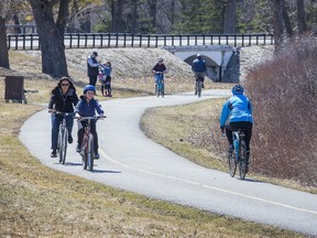 Pedestrians and cyclists are seen on the path that runs along the SJAM Parkway as the city and the world continue to deal with the COVID-19 pandemic.