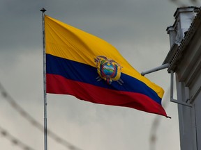 The Ecuadorean flag flutters over Carondelet Presidential Place in Quito on Oct, 9, 2019.