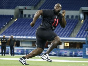 Oklahoma defensive lineman Neville Gallimore  goes through a workout drill during the 2020 NFL Combine.