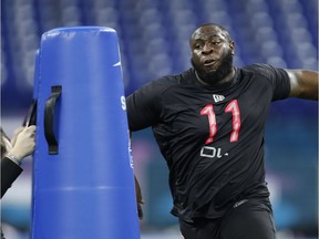 Oklahoma Sooners defensive lineman Neville Gallimore goes through a workout drill during the 2020 NFL Combine.
