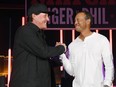 Phil Mickelson, left, and Tiger Woods greet each other at The Match: Tiger vs Phil VIP after party at Topgolf Las Vegas on Nov. 23, 2018 in Las Vegas, Nevada. (Ethan Miller/Getty Images for The Match)