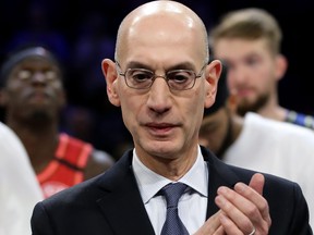 NBA Commissioner Adam Silver applauds after Team LeBron beat Team Giannis 157-155 in the 69th NBA All-Star Game at the United Center on Feb. 16, 2020 in Chicago, Ill.