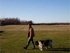 A farmer with his dog.