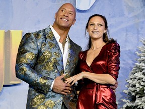 Dwayne Johnson (left) and Lauren Hashian arrive at the premiere of Sony Pictures' "Jumanji: The Red Carpet" on December 9, 2019, in Hollywood, Calif.