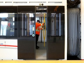 A worker cleans on the LRT in March 2020.