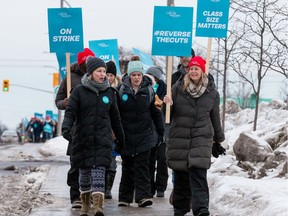 Teachers from the Ontario English Catholic Teachers Association picket along Merivale Road in February 2020.