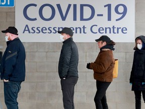 People wait to be tested at the COVID-19 testing centre at Brewer arena.