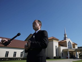 Pastor Tony Spell talks with journalists before attending Sunday service at the Life Tabernacle megachurch challenging state orders against assembling in large groups to prevent the spread of COVID-19, in Baton Rouge, Louisiana, April 5, 2020.