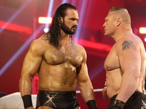 Drew McIntyre, left, faces off against Brock Lesnar. (WWE)