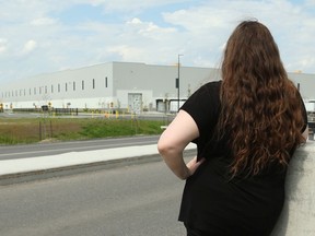 Rachel Westley stands in front of the Amazon warehouse in Ottawa.