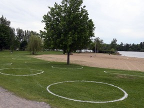 Physical distancing painted circles at Mooney's Bay's beach during COVID-19 on May 29, 2020.