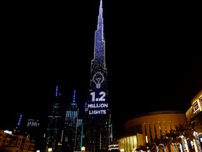 Dubai's Burj Khalifa, the world's tallest building, lit its 1.2 million lights to become the world's tallest donation box to buy meals for people hit by the impact of the new coronavirus disease (COVID-19) pandemic in Dubai, United Arab Emirates May 11, 2020.