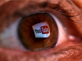 A picture illustration shows a YouTube logo reflected in a person's eye June 18, 2014.