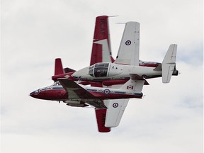 Four CT-114 Tutor jets of the Canadian Forces Snowbirds pass each other closely during their performance on Wednesday August 29, 2018 at the Community Charity Air Show in Brantford, Ontario.