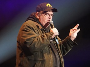Director Michael Moore speaks during a rally by U.S. Democratic presidential candidate Senator Bernie Sanders in Cedar Rapids, Iowa, U.S., Feb. 1, 2020.