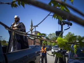 Imam Muhammad Sulaiman leads a special drive-in Eid prayer at the Ottawa Mosque on Saturday.