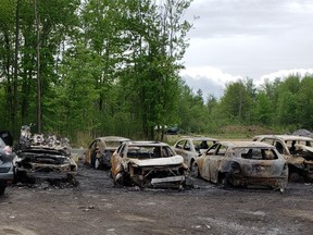 Arson squad investigating fire that destroyed several vehicles in yard on Leitrim Road.