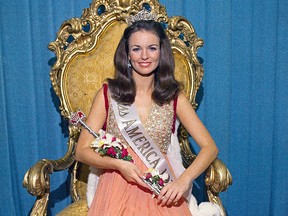 In this Sept. 12, 1970, file photo, Phyllis George, the former Miss Texas, poses after winning the national title of Miss America in Atlantic City, N.J.