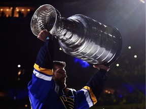 St. Louis Blues defenceman Alex Pietrangelo hoists the Stanley Cup as he skates around the ice prior to the 2019-20 home opener against the Washington Capitals at Enterprise Center on Oct. 2, 2019.