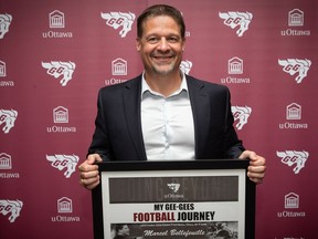 The Ottawa Gee-Gees have hired Marcel Bellefeuille as their head football coach.