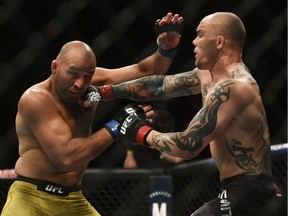 Anthony Smith (red gloves) fights Glover Teixeira (blue gloves) during UFC Fight Night at VyStar Veterans Memorial Arena in Jacksonville on May 13, 2020.
