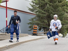 Jean-Gabriel Pageau and Cody Ceci leave the Minto Arena after the private facility re-opened their doors  to supervised and distant hour long skating.