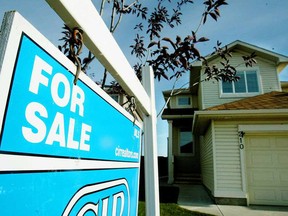 A for sale sign sits outside this home in the city of Coventry Hills in Alberta.