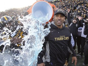 Hamilton Tiger-Cats head coach Orlondo Steinauer is doused with ice water after his team won the CFL's East final at Tim Hortons Field in 2019.