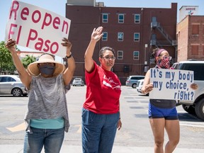 Protestors gather outside the El Paso County Court House during a rally calling for the reopening of El Paso and Texas on April 25, 2020.