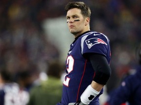 Patriots QB Tom Brady looks on from the sideline during the the AFC Wild Card Playoff game against the Titans at Gillette Stadium in Foxborough, Mass., on Jan. 4, 2020.