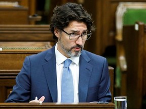 Prime Minister Justin Trudeau waits for a meeting of the special committee on the COVID-19 pandemic to begin in the House of Commons on Parliament Hill in Ottawa, May 13, 2020.