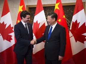 In this Dec. 5, 2017, file photo, Prime Minister Justin Trudeau meets Chinese President Xi Jinping at the Diaoyutai State Guesthouse in Beijing, China.