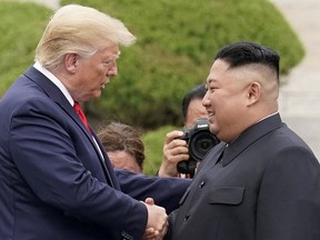 In this June 30, 2019, file photo, U.S. President Donald Trump meets with North Korean leader Kim Jong Un at the demilitarized zone separating the two Koreas, in Panmunjom, South Korea.
