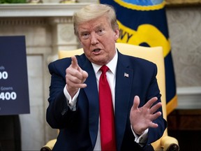 U.S. President Donald Trump speaks to reporters in the Oval Office at the White House May 7, 2020 in Washington.