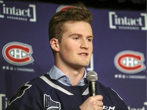 Alexis Lafrenière of the junior hockey Rimouski Océanic answers questions at a ceremony unveiling the logo for the coming National Hockey League draft prior to game between the Canadiens and Arizona in Montreal on Feb. 10, 2020.