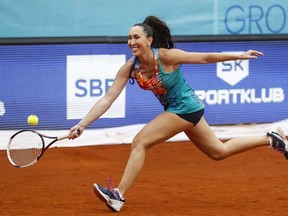 Jelena Jankovic returns the ball during a tennis doubles match against Nenad Zimonjic and Olga Danilovic at a charity tournament prior to the Adria Tour tennis event, in Belgrade, Serbia, Friday, June 12, 2020.