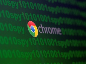 Google Chrome logo is seen near cyber code and words "spy" in this illustration picture taken June 18, 2020.