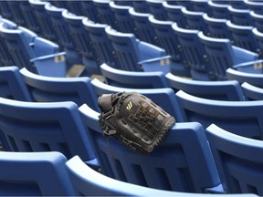 A file photo of empty seats at a baseball stadium.