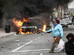 Cars burn in Baltimore on April 27, 2015.