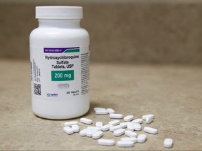 In this file photo taken on May 20, 2020 a bottle and pills of Hydroxychloroquine sit on a counter at Rock Canyon Pharmacy in Provo, Utah.