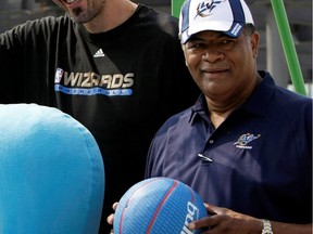 A 2009 file photo shows Hall of Famer Wes Unseld with others at the construction site for the USA pavilion in Shanghai.