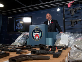Toronto Police display handguns that had been hidden in a fuel tank and were seized as part of Project Belair.