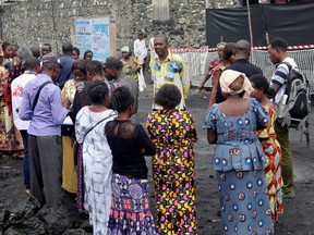 Congolese residents gather around Medecins Sans Frontieres health workers as they prepare the introduction of the second Ebola vaccine produced by Johnson & Johnson, in Goma, Democratic Republic of Congo, Nov. 14, 2019.