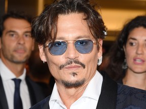 Johnny Depp walks the red carpet ahead of the "Waiting For The Barbarians" screening during the 76th Venice Film Festival at Sala Grande on Sept. 6, 2019 in Venice, Italy.