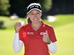 Brooke Henderson poses with the Sandra Post medal for being the leading Canadian in the 2019 CP Womens Open at Aurora, Ont.